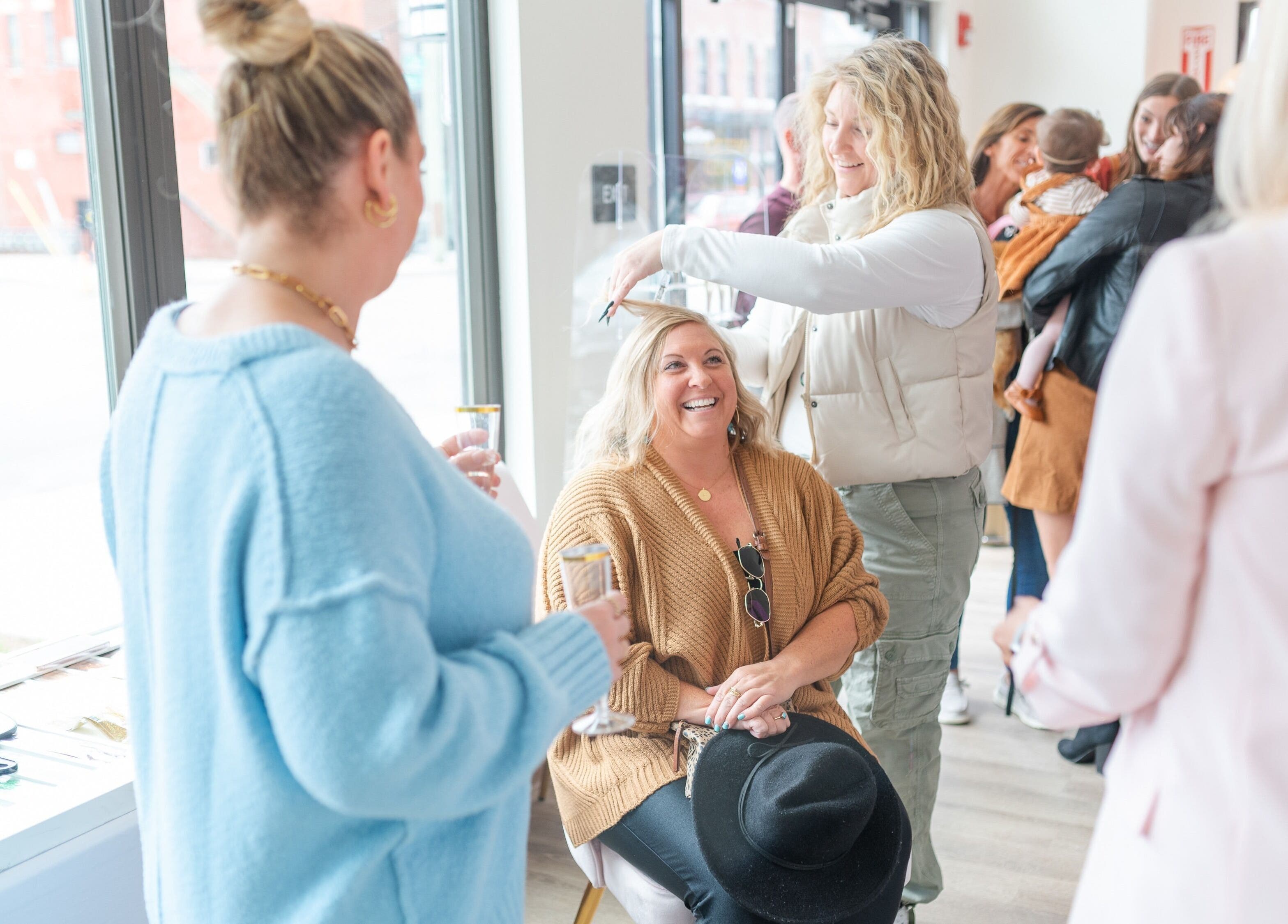 Guests enjoying hair styling at Twinkling Tresses: Lakeland - Florida (COhatch), Lakeland, Florida, US.