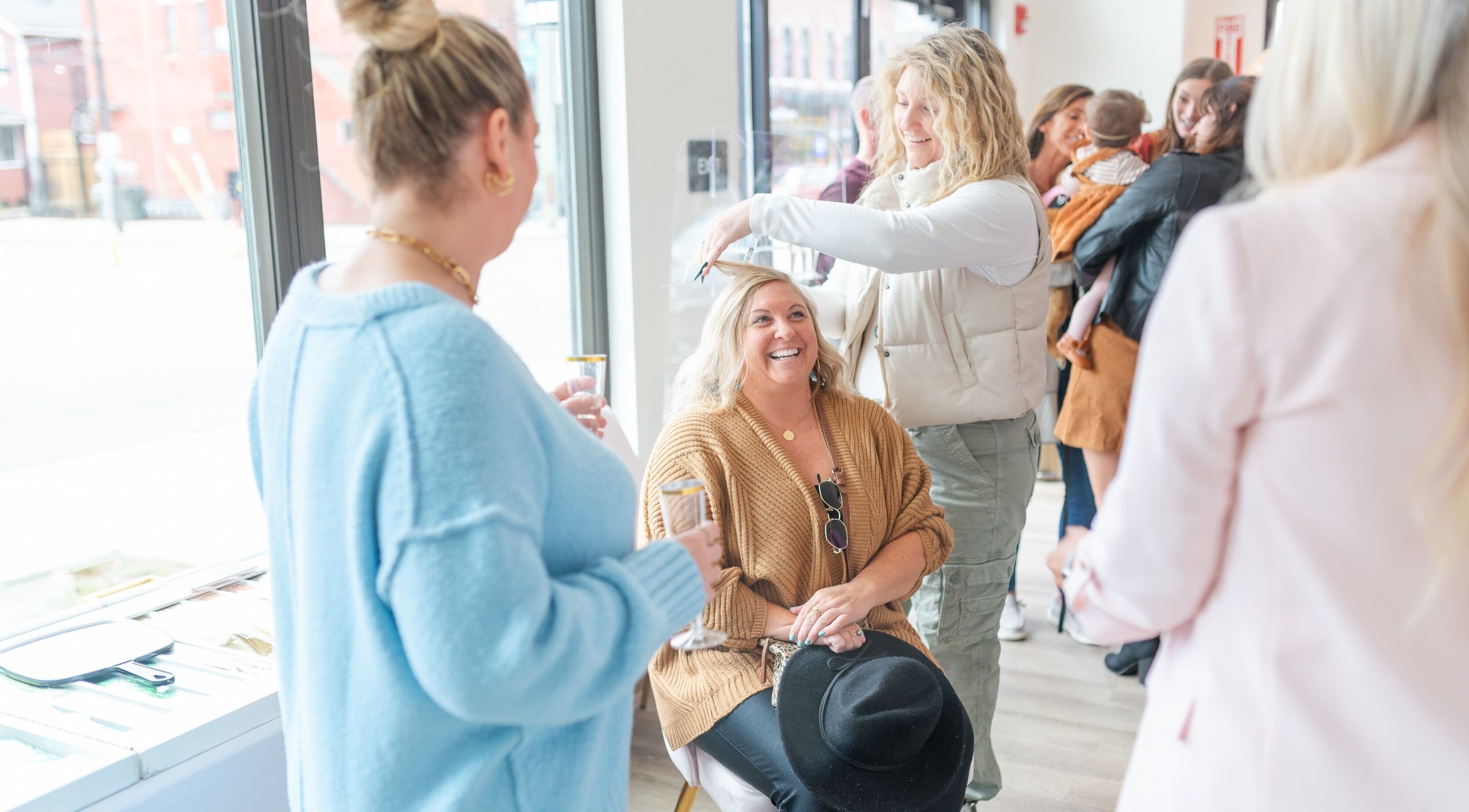 Guests enjoying hair styling at Twinkling Tresses: Lakeland - Florida (COhatch), Lakeland, Florida, US.