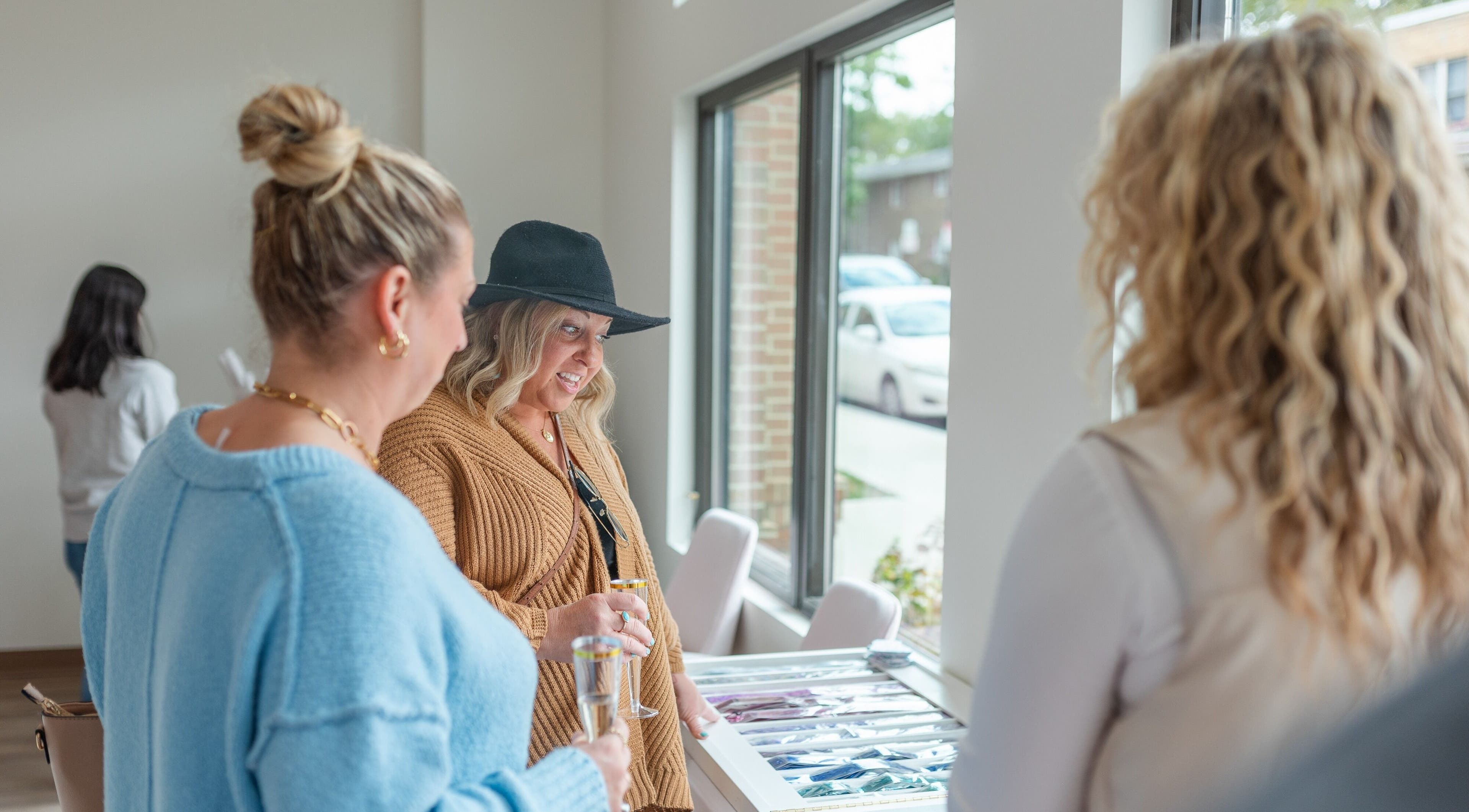 Guests enjoying a chic gathering at Twinkling Tresses: Lakeland - Florida (COhatch).