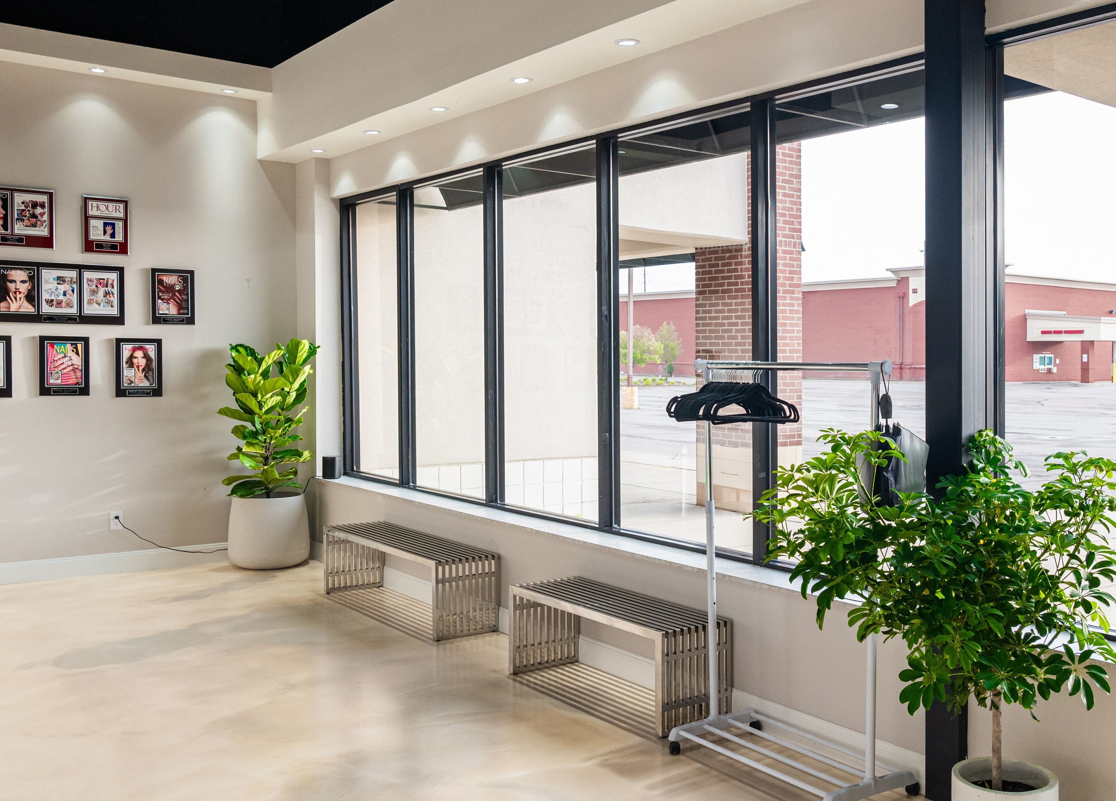 Bright interior of Gloss Nail Atelier, Sterling Heights, Michigan, US, showcasing elegant decor and natural light.