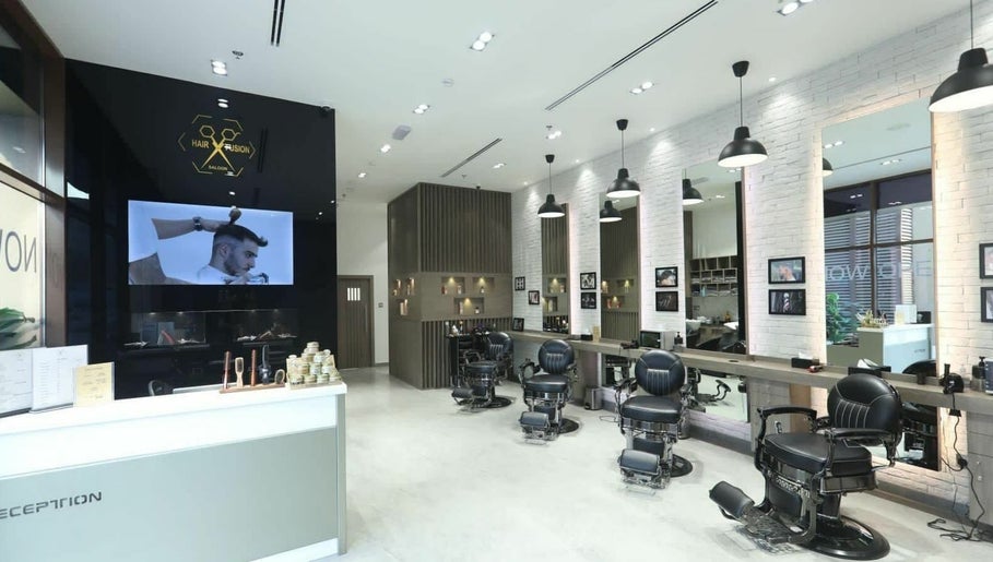 Interior of Hair Fusion Gents Saloon Wadi Al Safa 3 Branch in دبي, دبي, AE showcasing modern barber chairs.