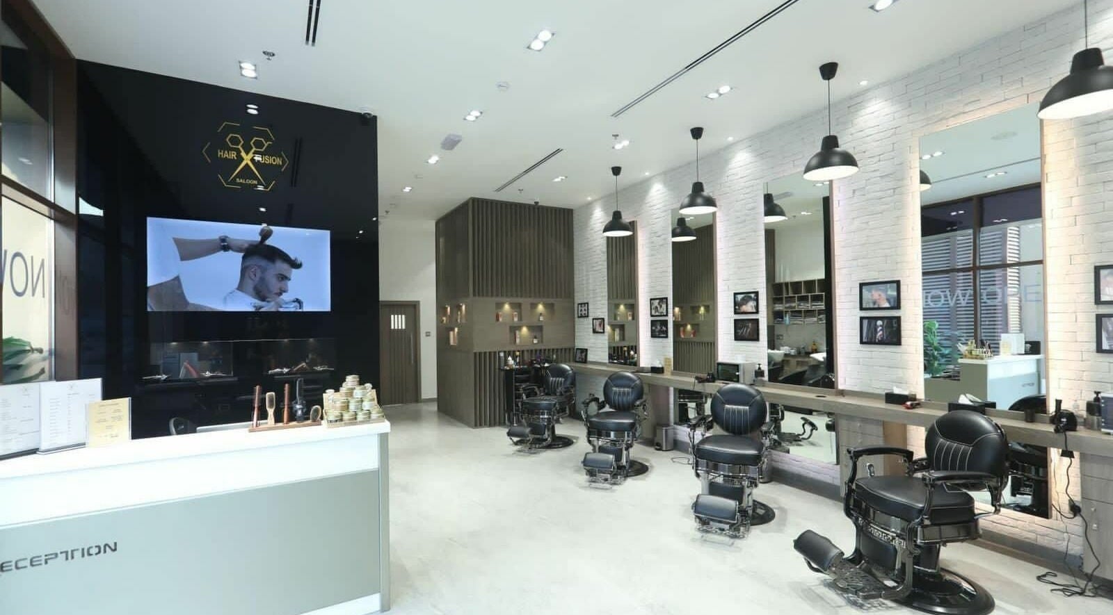 Interior of Hair Fusion Gents Saloon Wadi Al Safa 3 Branch in دبي, دبي, AE showcasing modern barber chairs.