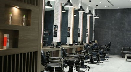 Chic interior of Hair Fusion Gents Saloon Wadi Al Safa 3 Branch, دبي, دبي, AE, showcasing modern styling chairs.