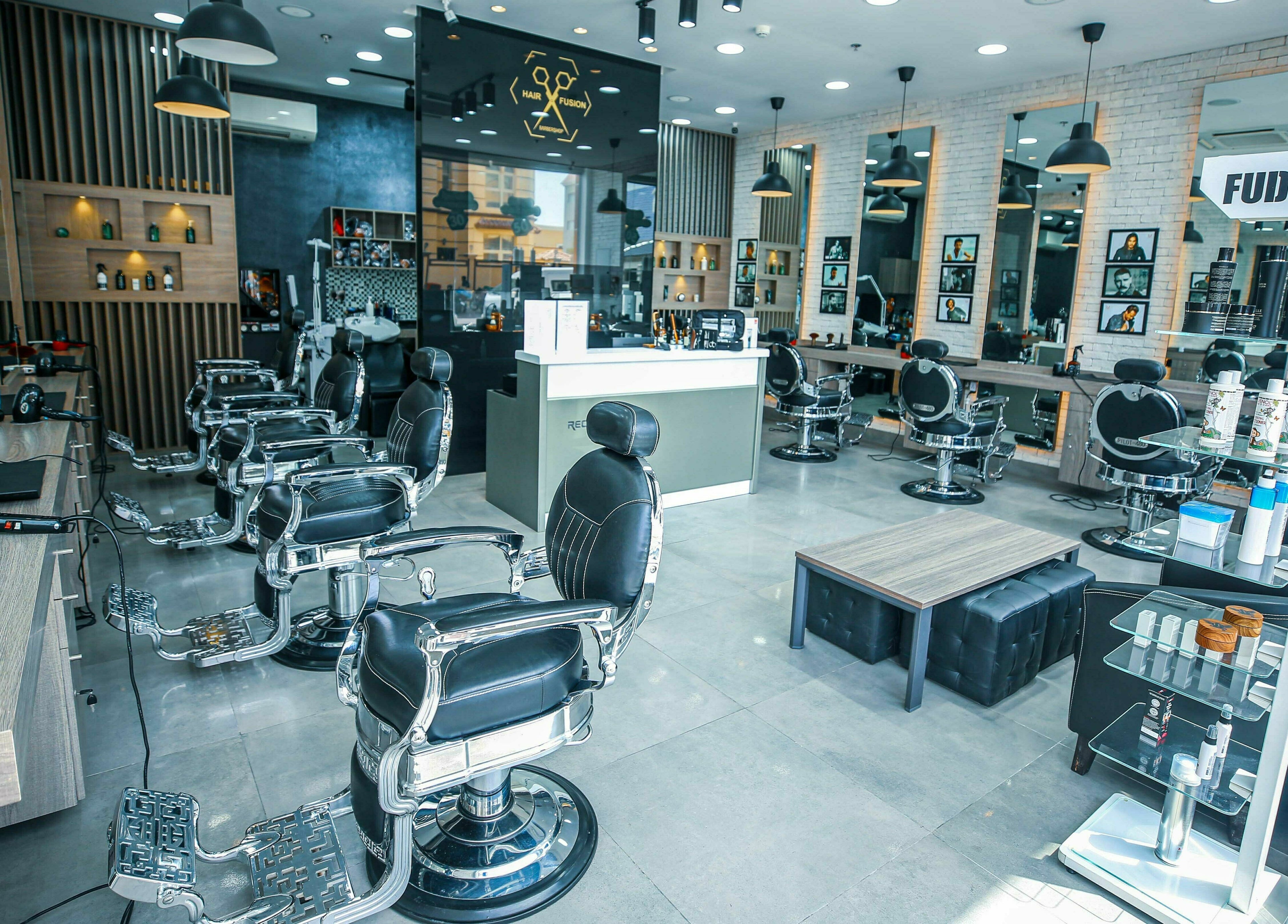 Modern interior of Ward Salon in Dubai, Dubai, AE, showcasing sleek styling chairs and well-lit mirrors.