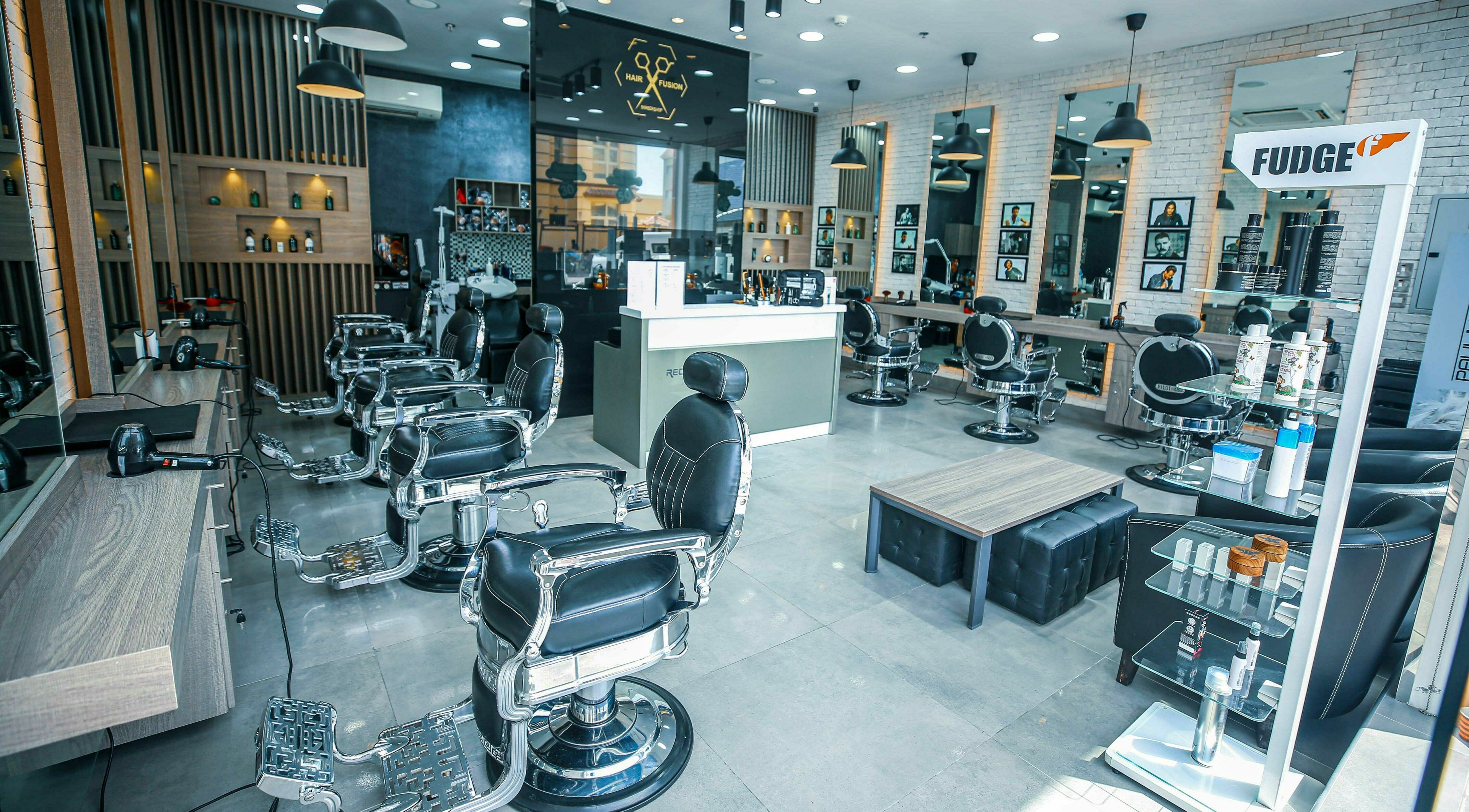 Modern interior of Ward Salon in Dubai, Dubai, AE, showcasing sleek styling chairs and well-lit mirrors.
