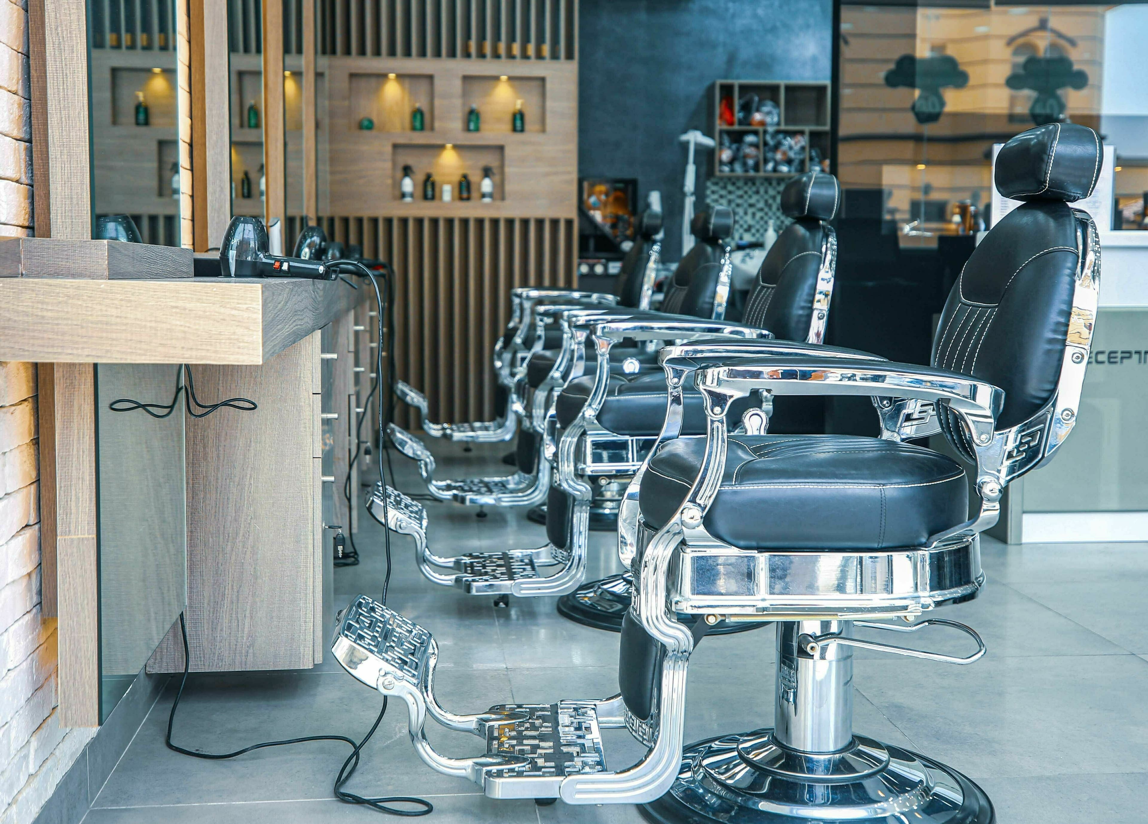 Elegant barber chairs at Ward Salon, Dubai, Dubai, AE, showcasing modern style and comfort.