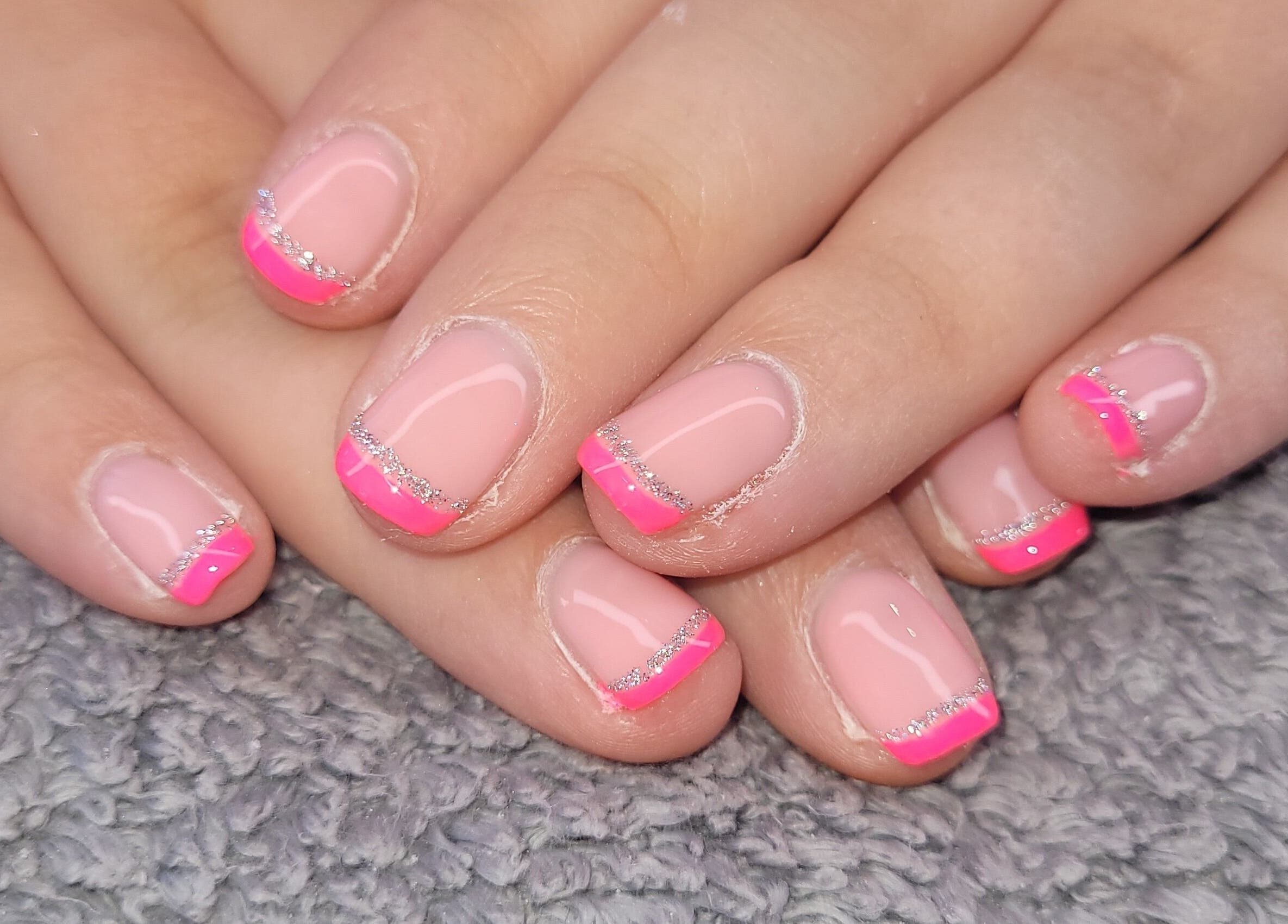Neon pink and silver nail design at Beauty By Jo, Guiseley, England, GB.