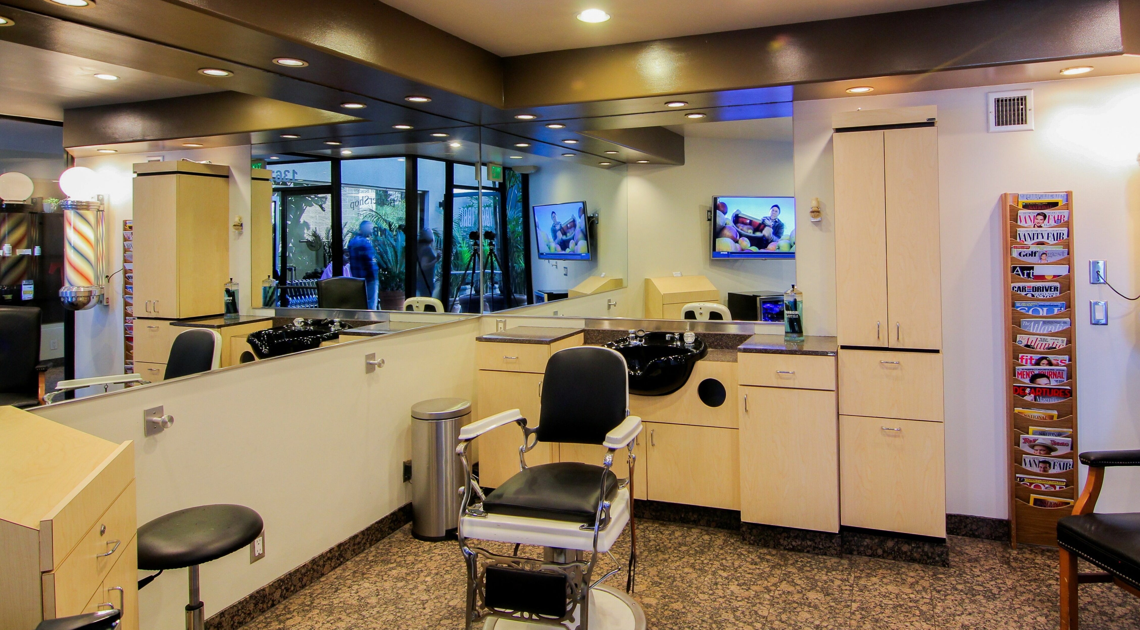 Modern interior of Newport Beach Barbershop in Newport Beach, California, US with sleek barber chair.