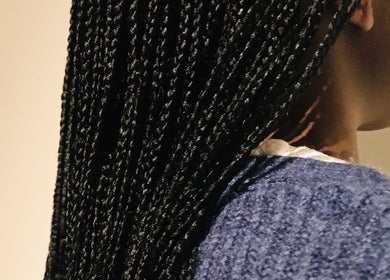 Elegant braids at Lewa hair in Newmarket, England, GB showcasing intricate styling detail.