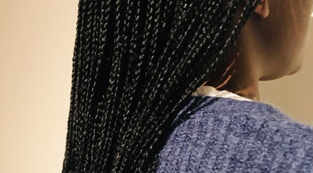 Elegant braids at Lewa hair in Newmarket, England, GB showcasing intricate styling detail.