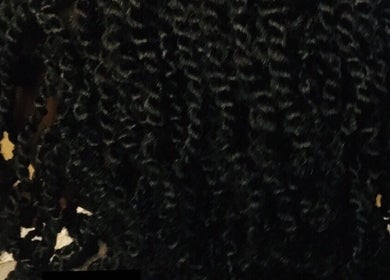 Elegant curly hairstyle showcased at Lewa Hair, Newmarket, England, GB enhancing natural beauty.