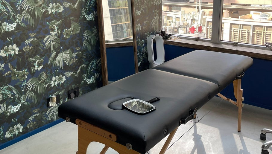 Chic treatment room at Brilliance Bay Piercing Boutique in Central, Hong Kong Island, HK with floral decor.