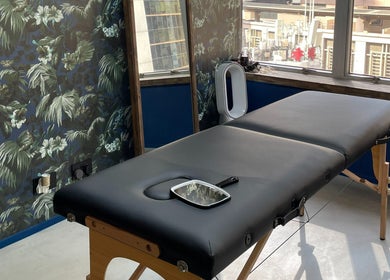 Chic treatment room at Brilliance Bay Piercing Boutique in Central, Hong Kong Island, HK with floral decor.