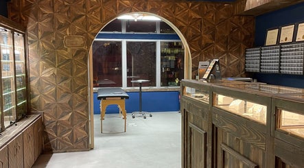 Elegant interior of Brilliance Bay Piercing Boutique, Central, Hong Kong Island, HK. Wood decor and piercing station.