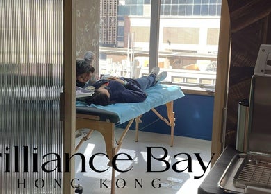 Client receiving piercing at Brilliance Bay Piercing Boutique, Central, Hong Kong Island, HK.
