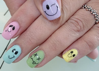 Colorful smiley face nail art at Tippity Toes Nails and Beauty in Krugersdorp, Gauteng, ZA.