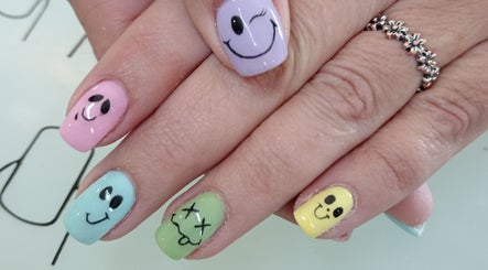 Colorful smiley face nail art at Tippity Toes Nails and Beauty in Krugersdorp, Gauteng, ZA.