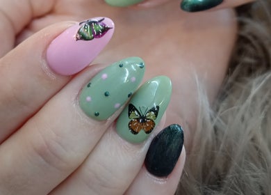 Elegant butterfly nail art at Tippity Toes Nails and Beauty, Krugersdorp, Gauteng, ZA. Perfect for stylish looks.