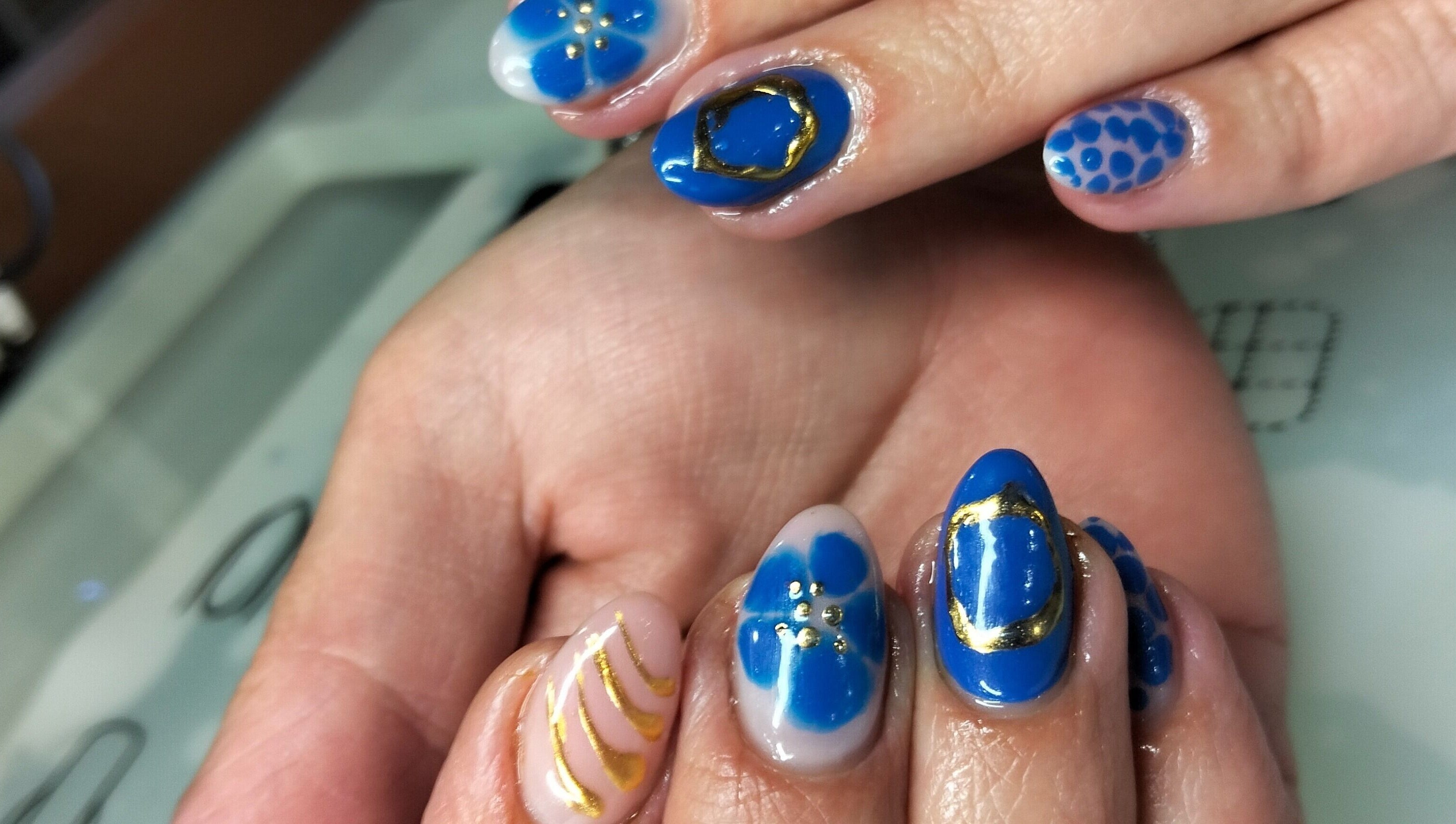 Elegant blue nail art at Tippity Toes Nails and Beauty, Krugersdorp, Gauteng, ZA showcasing intricate designs.