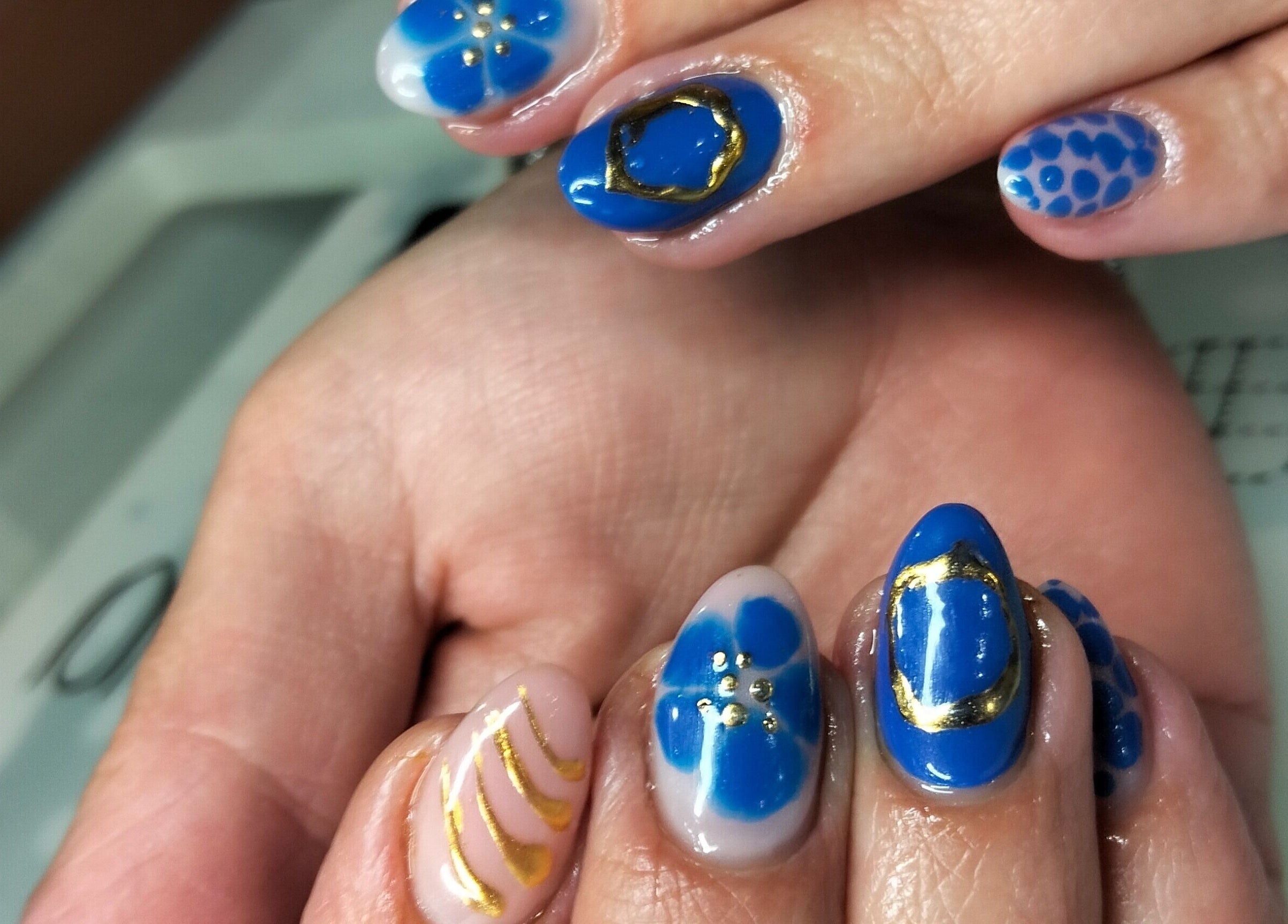 Elegant blue nail art at Tippity Toes Nails and Beauty, Krugersdorp, Gauteng, ZA showcasing intricate designs.