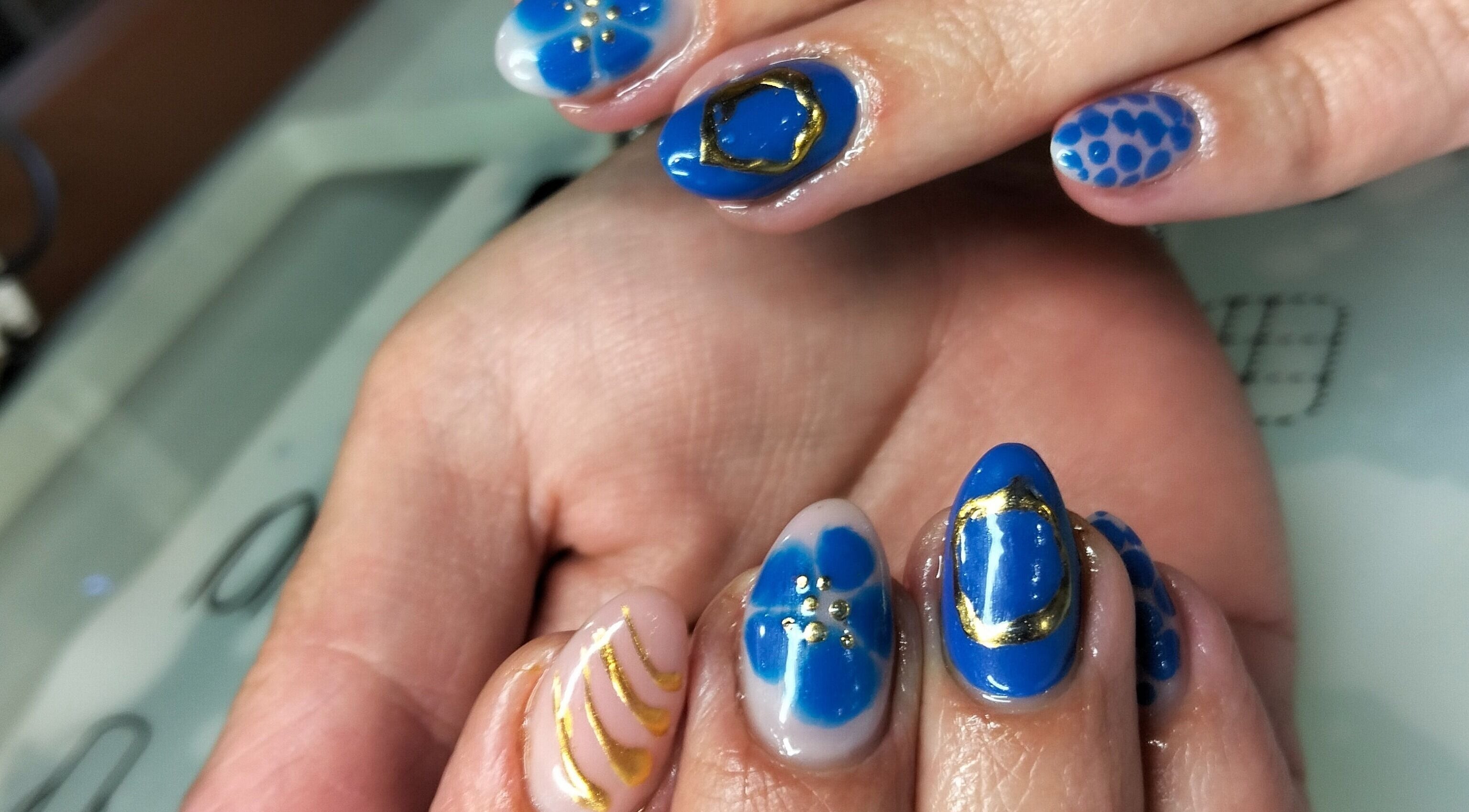 Elegant blue nail art at Tippity Toes Nails and Beauty, Krugersdorp, Gauteng, ZA showcasing intricate designs.