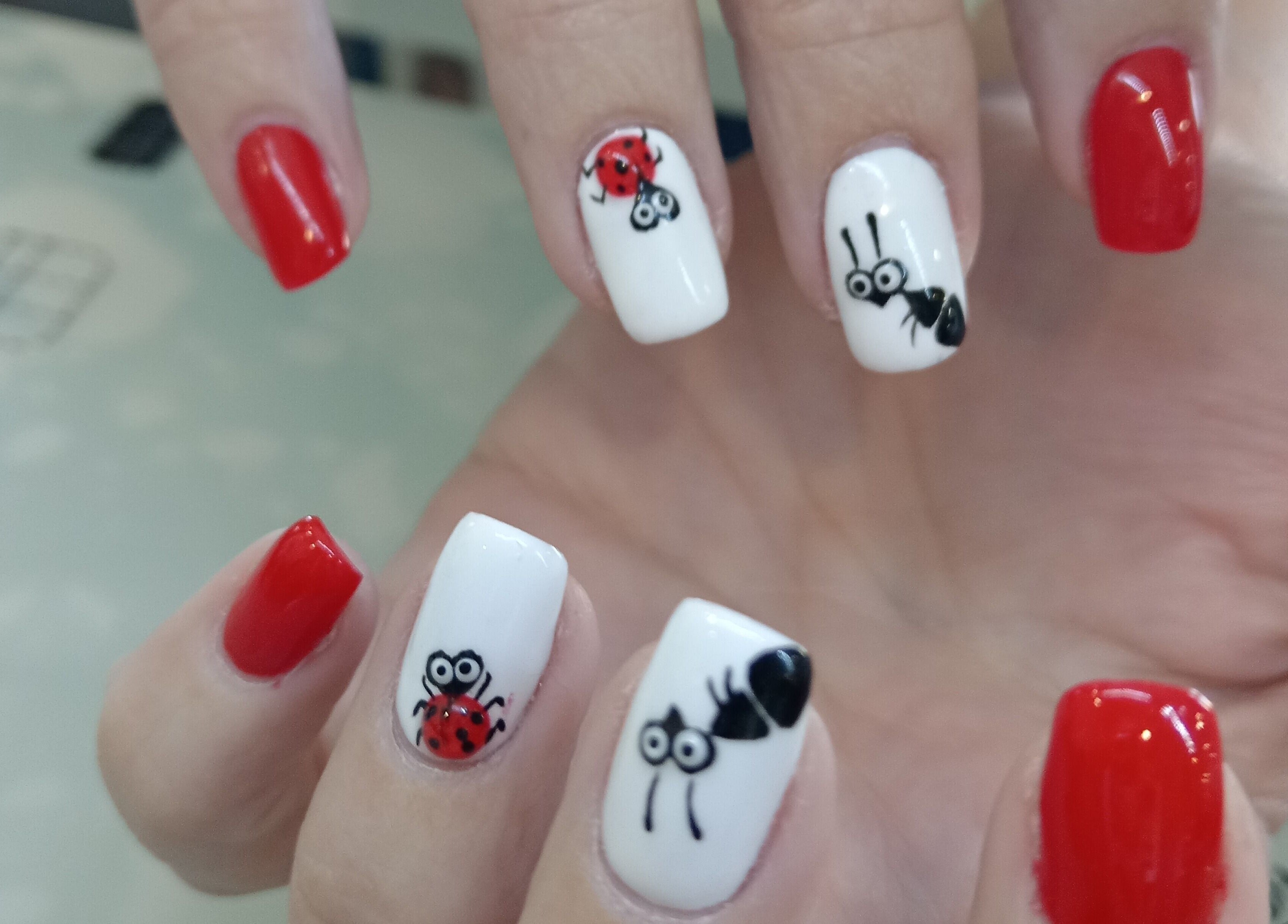 Creative bug-themed nail art at Tippity Toes Nails and Beauty in Krugersdorp, Gauteng, ZA, showcasing vibrant designs.