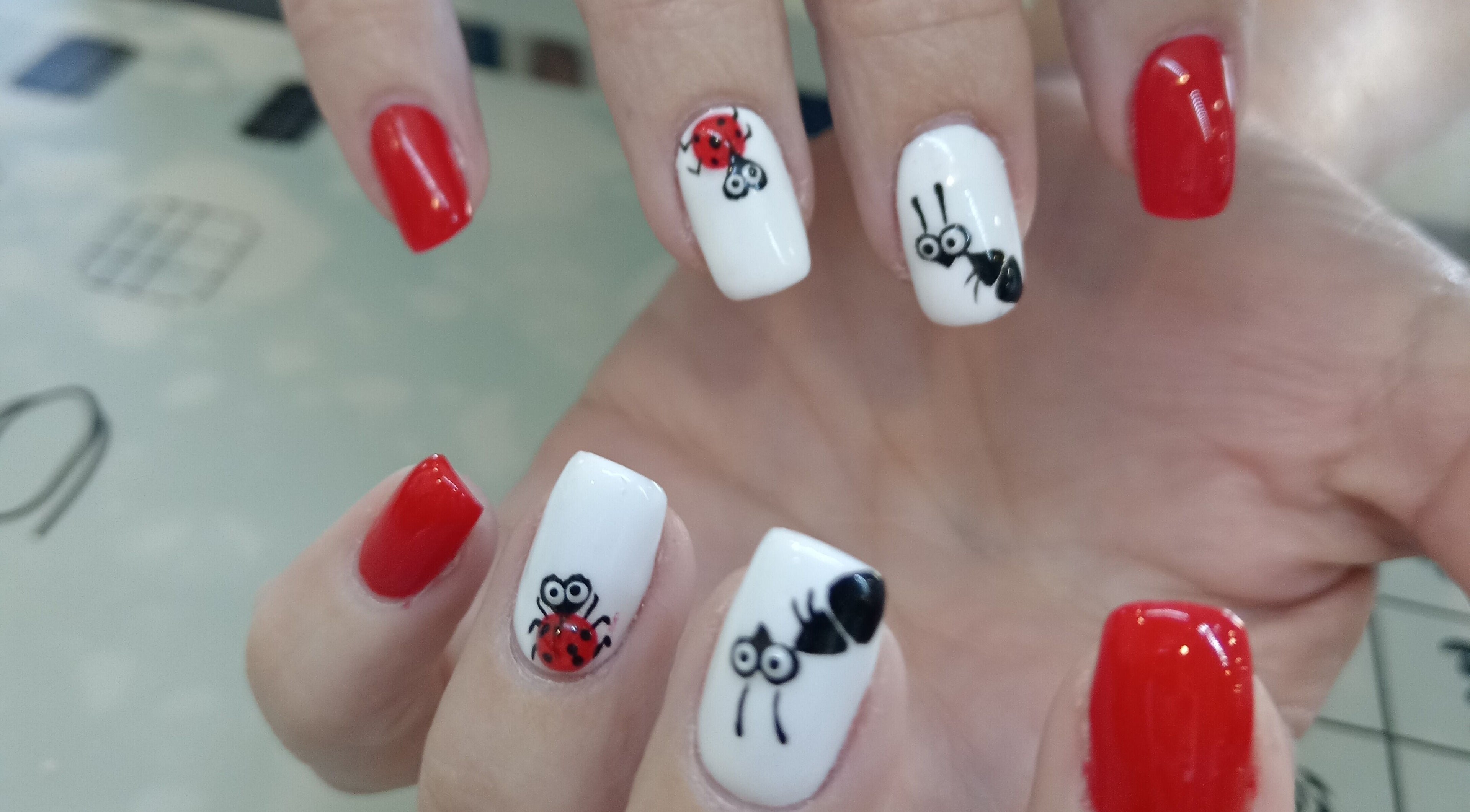 Creative bug-themed nail art at Tippity Toes Nails and Beauty in Krugersdorp, Gauteng, ZA, showcasing vibrant designs.