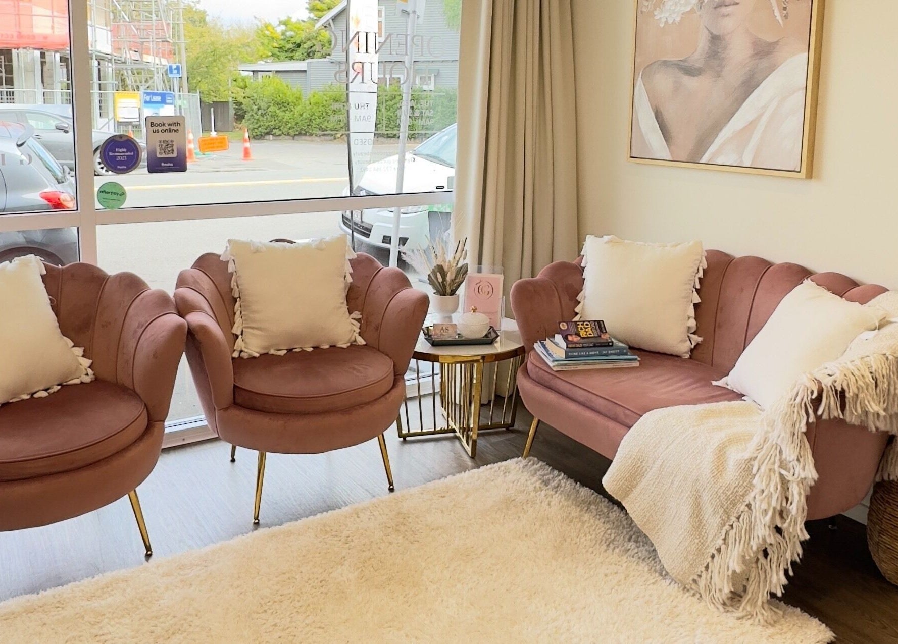 Elegant pink seating at Glowing Goddess Beauty, Christchurch, Canterbury, NZ. Inviting and chic lounge area.