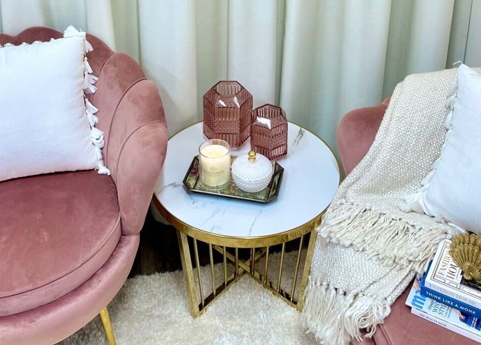 Elegant pink chairs with soft white cushions at Glowing Goddess Beauty, Christchurch, Canterbury, NZ.
