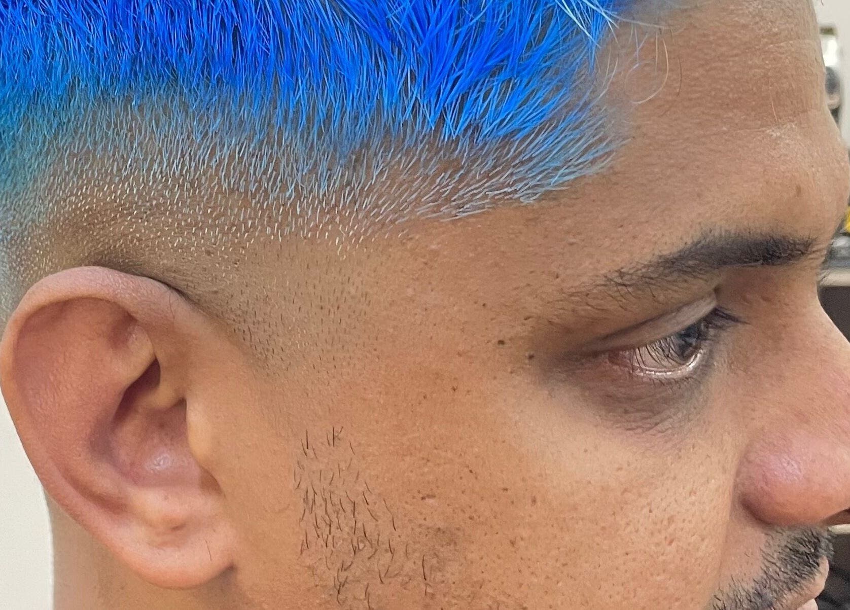 Close-up of a vibrant blue hair dye at Waz Hair Care, Grand Port, MU.