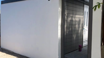 The Cabin entrance in Bristol, England features a sleek modern design for a welcoming experience.