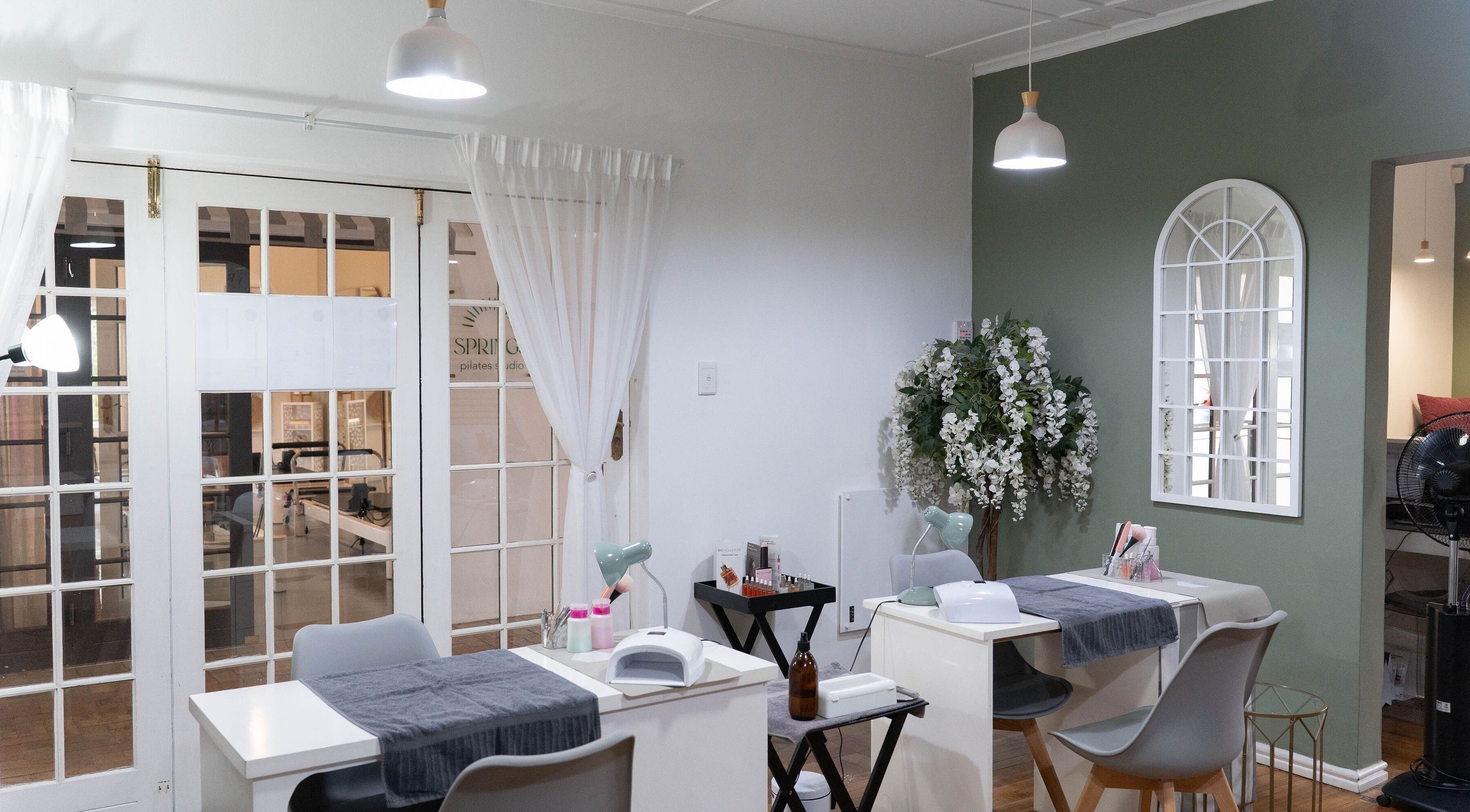 Elegant nail care station at The Fresh Coat, Cape Town, Western Cape, ZA with modern decor and white florals.