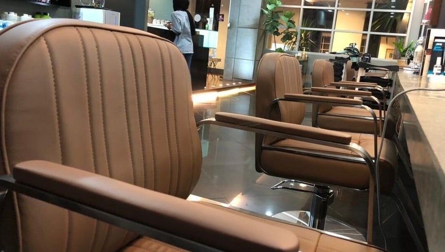 Comfortable salon chairs at Hairkunst, Petaling Jaya, Selangor, MY, enhancing the stylish interior.