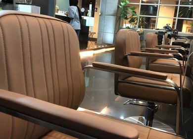 Comfortable salon chairs at Hairkunst, Petaling Jaya, Selangor, MY, enhancing the stylish interior.