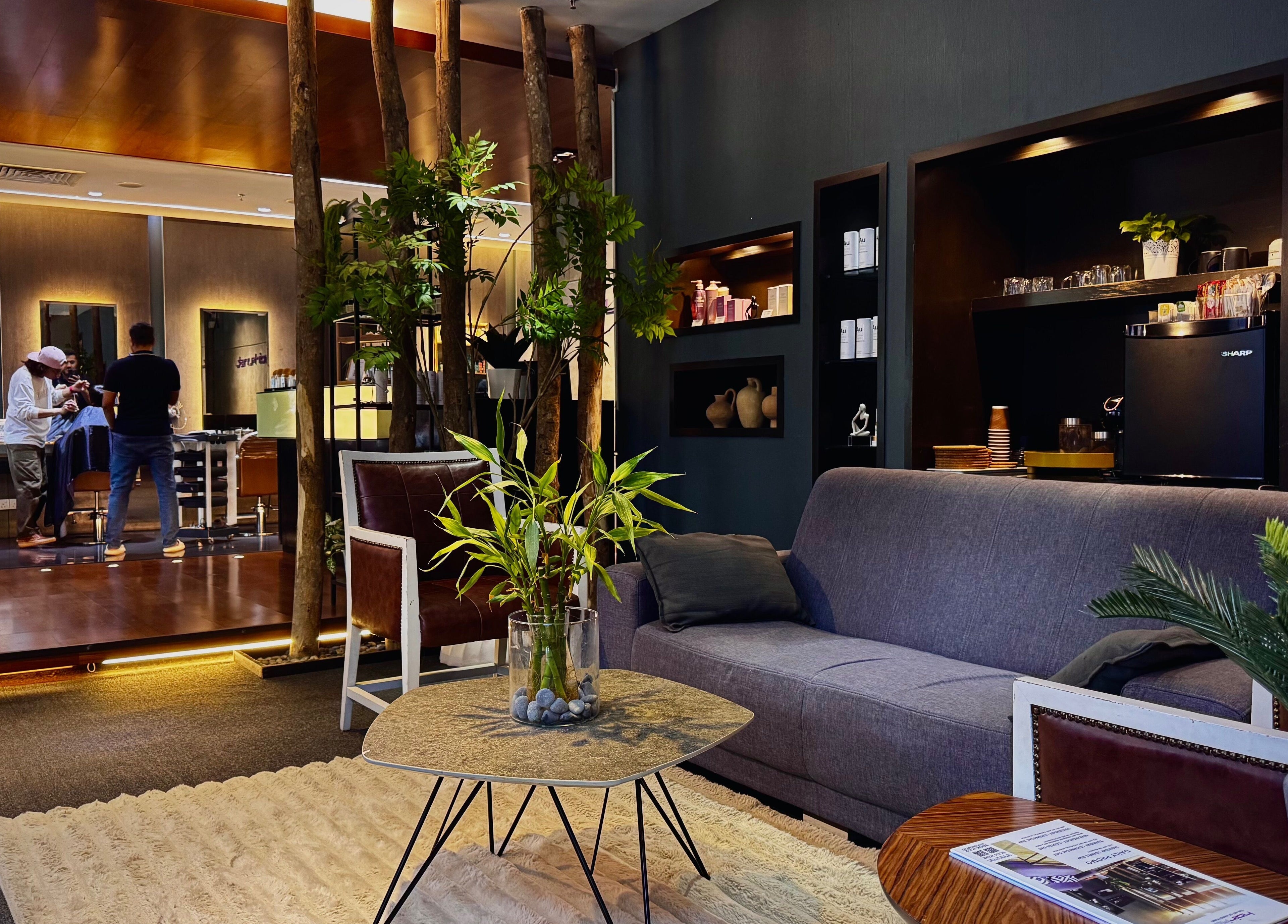 Modern interior of Hairkunst Premium Salon in Petaling Jaya, Selangor, MY featuring luxe seating and decor.