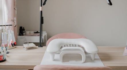 Cozy nail station at AbiLou Beauty, Stowmarket, England, GB with pink chair and manicure tools.