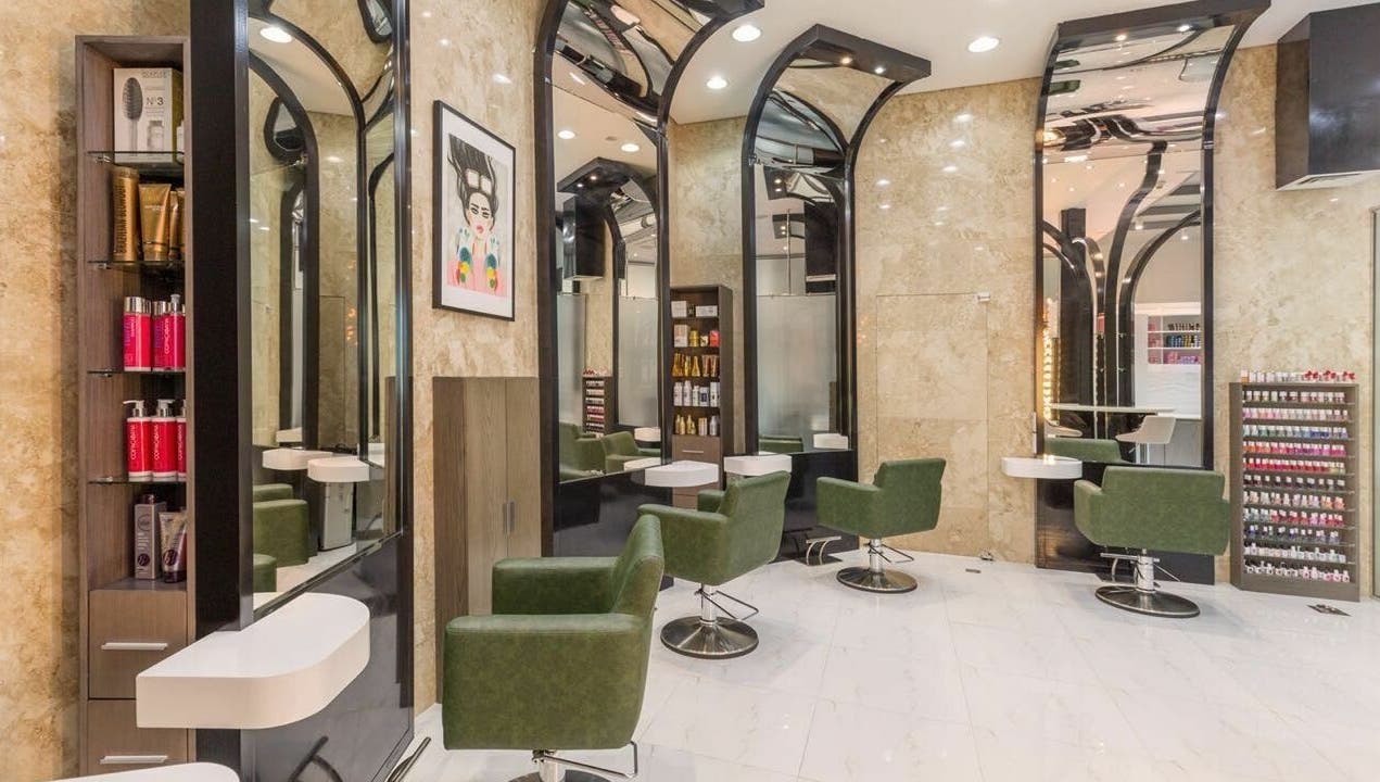 Modern interior of Ricci Capricci in Dubai, Dubai, AE featuring stylish green chairs and sleek design.