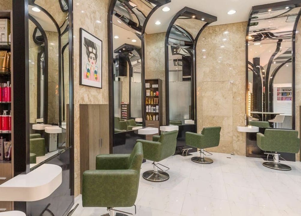 Modern interior of Ricci Capricci in Dubai, Dubai, AE featuring stylish green chairs and sleek design.