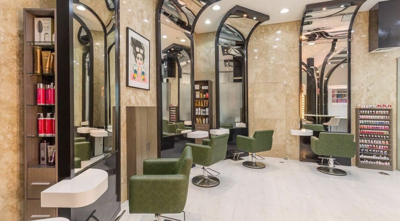 Modern interior of Ricci Capricci in Dubai, Dubai, AE featuring stylish green chairs and sleek design.