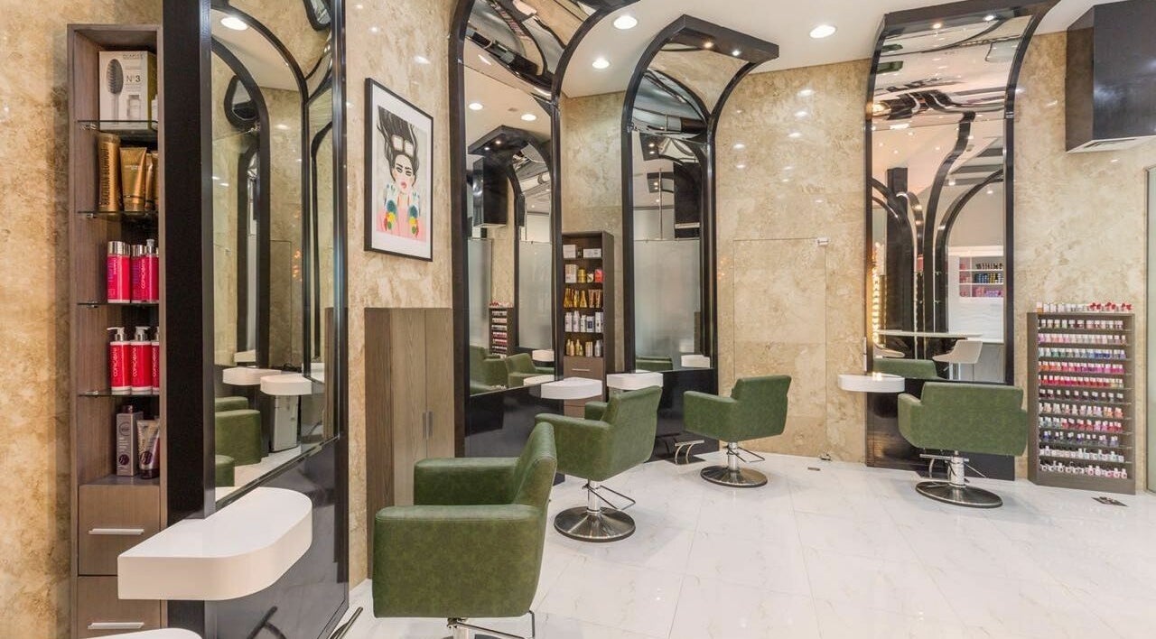 Modern interior of Ricci Capricci in Dubai, Dubai, AE featuring stylish green chairs and sleek design.