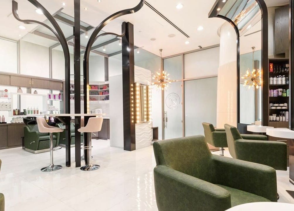Elegant interior of Ricci Capricci salon in Dubai, Dubai, AE showcasing chic decor and stylish seating.