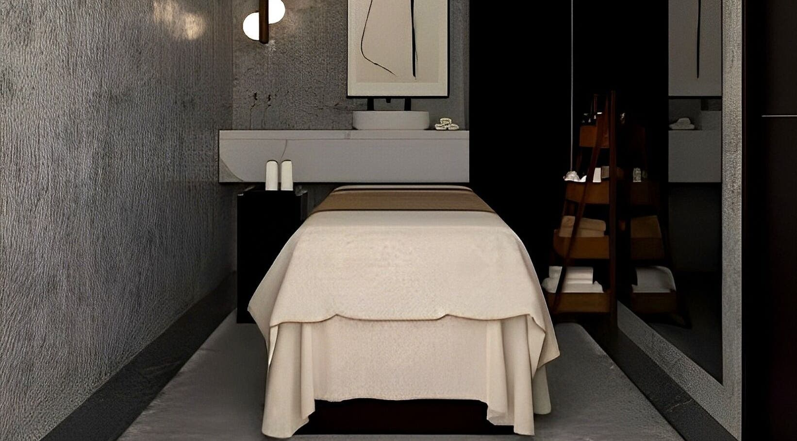 Tranquil treatment room at Aqua Face Facial Bar, Dubai, Dubai, AE, with a cozy massage bed and modern decor.