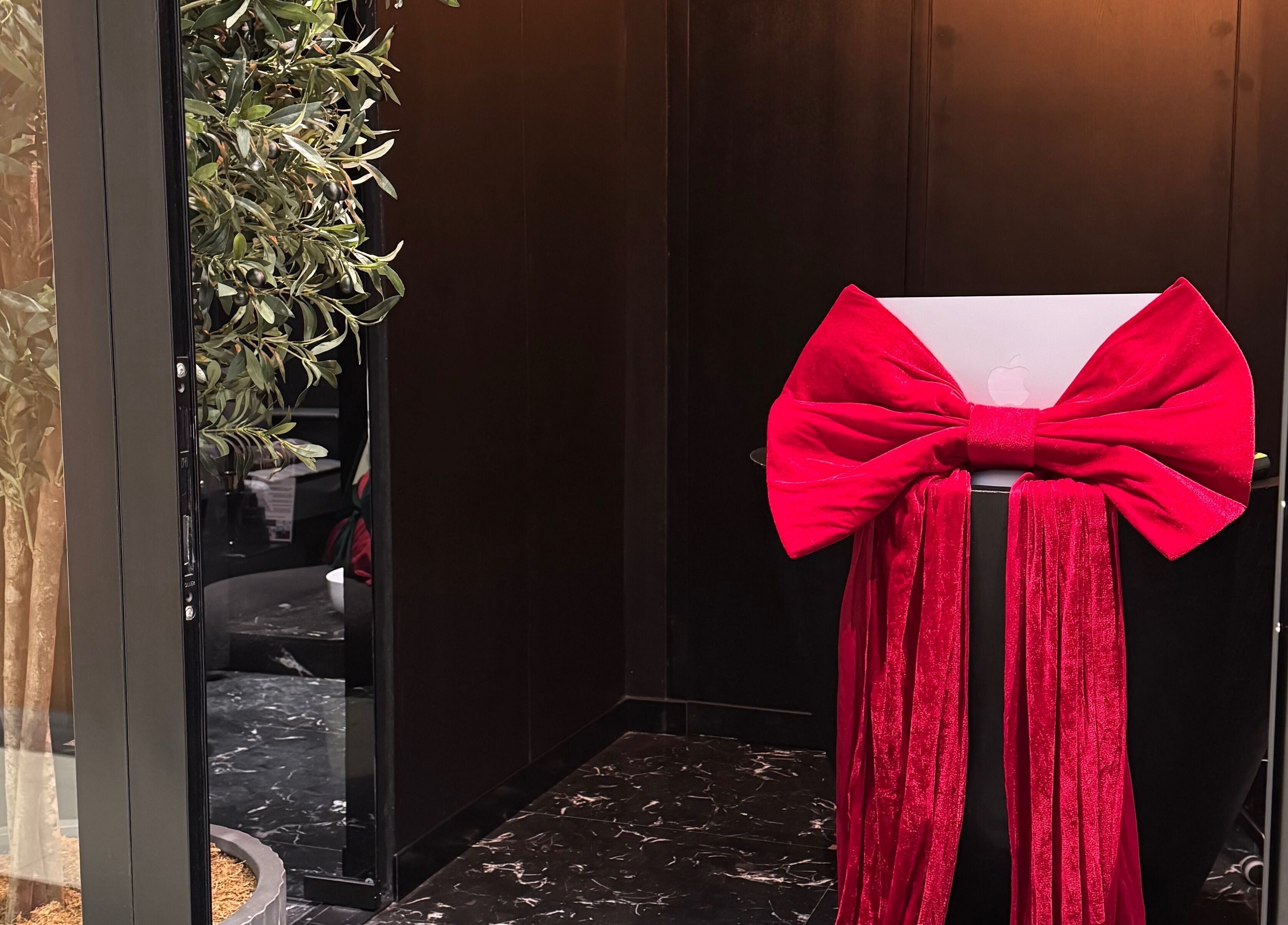Stylish entrance with red ribbon decor at Aqua Face Facial Bar in Dubai, Dubai, AE.