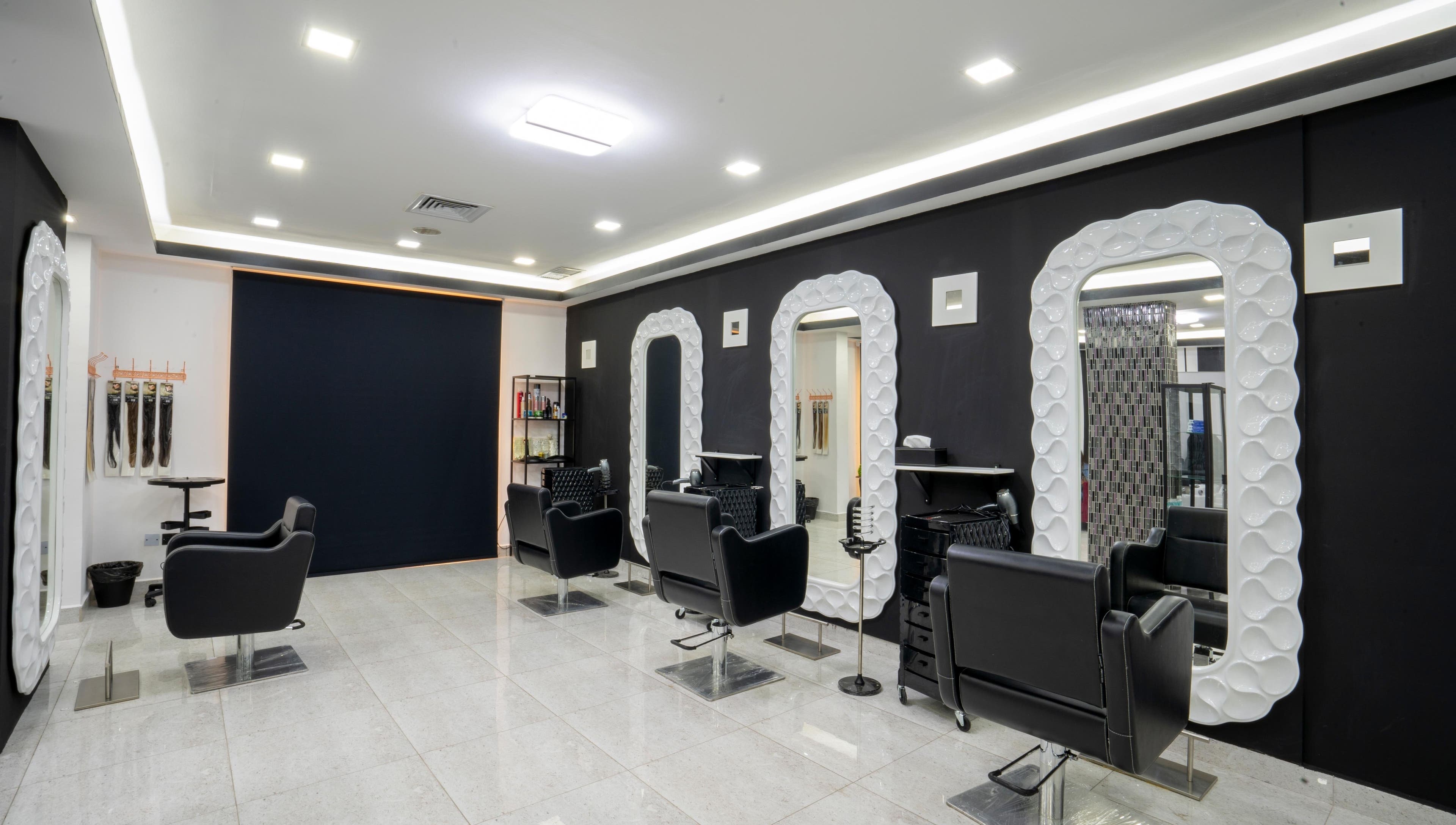 Sleek styling chairs and mirrors at Beauty Lounge, Salmiya, Hawalli Governorate, KW.