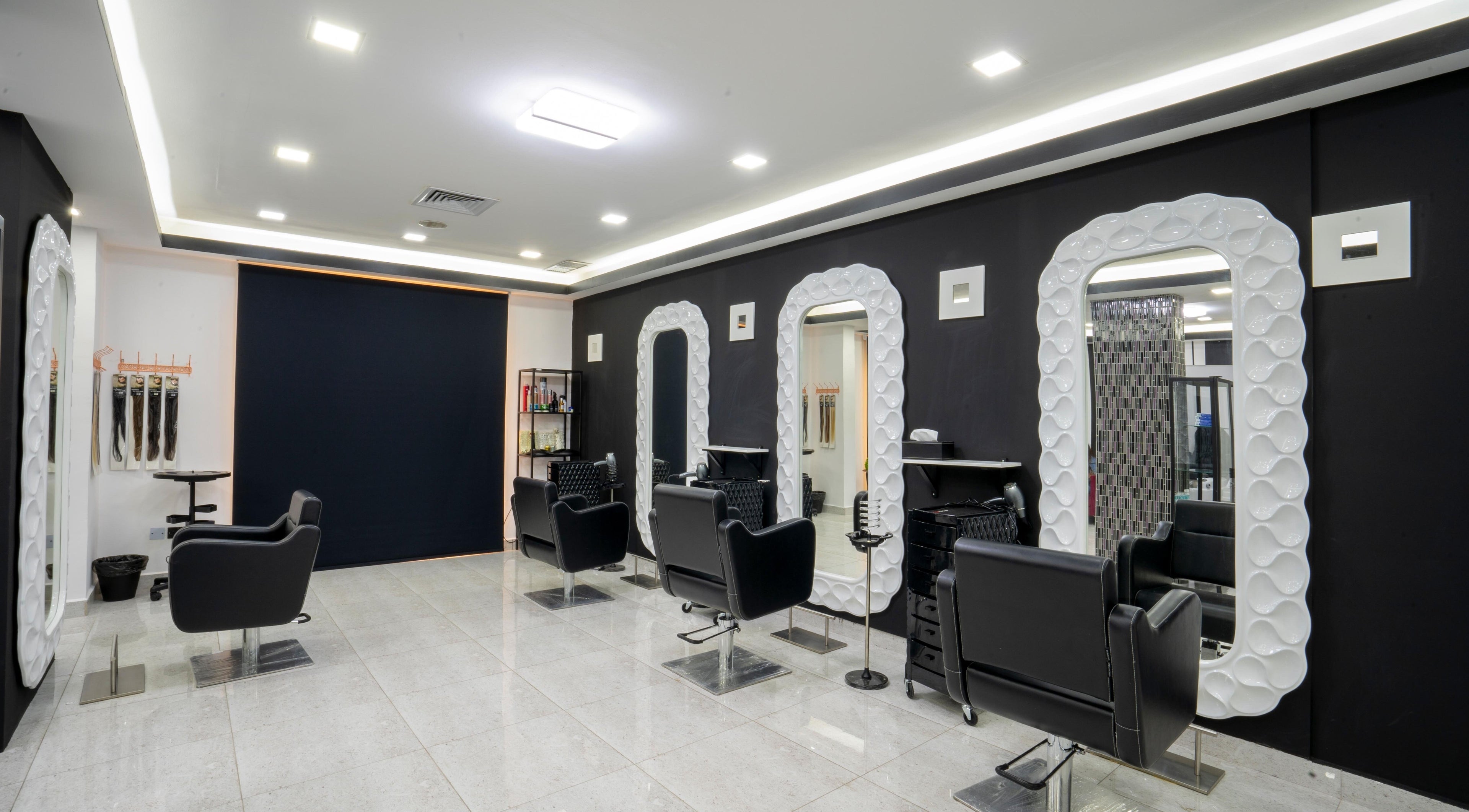 Sleek styling chairs and mirrors at Beauty Lounge, Salmiya, Hawalli Governorate, KW.