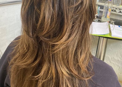 Luscious layered hair styled at Hair Muse, Pretoria, Gauteng, ZA. Perfect blend of color and texture.
