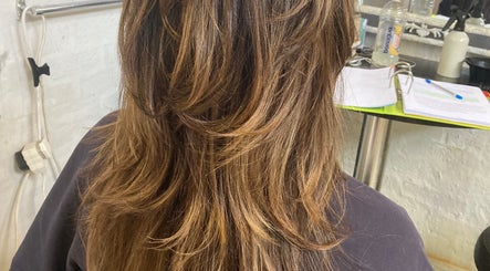 Luscious layered hair styled at Hair Muse, Pretoria, Gauteng, ZA. Perfect blend of color and texture.