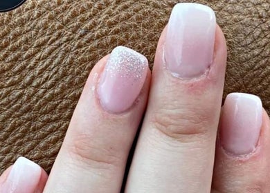 Elegant pink nails with glitter at Royal Beauty in Bloemfontein, Free State, ZA.