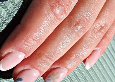 Close-up of elegant nail art at Royal Beauty, Bloemfontein, Free State, ZA showcasing intricate modern designs.