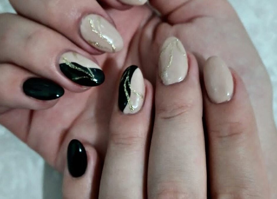 Stylish manicure at Royal Beauty in Bloemfontein, Free State, ZA with black and nude nail design.